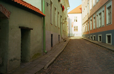 Obraz na płótnie Canvas Panoramic view of the central streets of Tallinn on a summer morning in Estonia. Real grain scanned film.