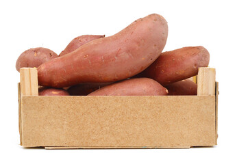 Bunch of sweet potatoes in a wooden crate on a white background