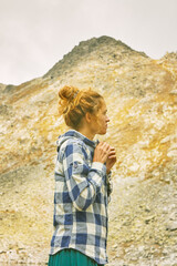 Naklejka premium Young Caucasian woman traveling in the mountains of Bulgaria. Near Mount Vihren.