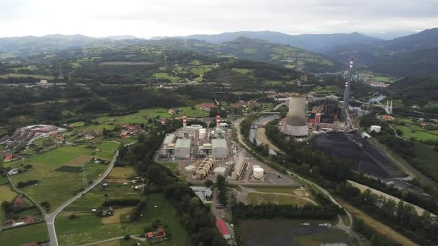 Chemical industry in beautiful valley of Oviedo. Asturias, Spain. Aerial Drone Footage