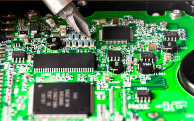repairing a printed circuit board. Micro technology and repairs. Electronic components and conductors