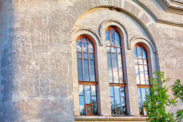 Fototapeta na wymiar Cathedral exterior wall with arched window 