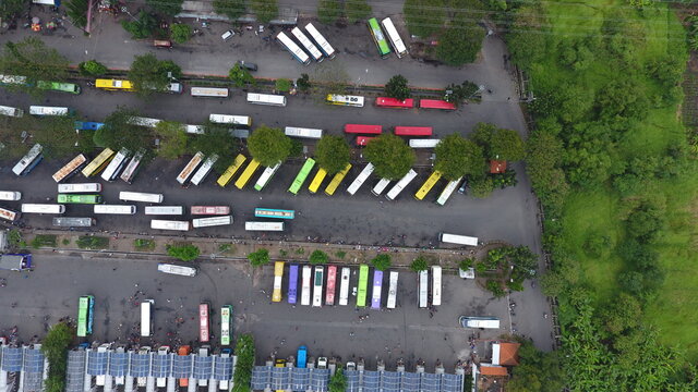 Aerial view of bus parking in the Purabaya Bus Terminal area, Sidoarjo, East Java, Indonesia