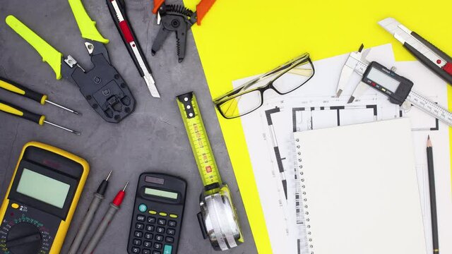 Construction and building tools move on grey yellow theme. Stop motion 