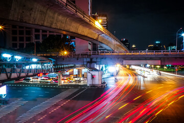 Fototapeta na wymiar Light trails on the street at sathorn square bangkok thailand.