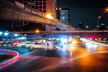 Fototapeta na wymiar Light trails on the street at sathorn square bangkok thailand.