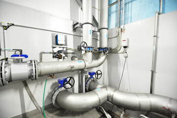 Large blue tanks in a industrial city water treatment boiler room. Wide angle perspective. Special...