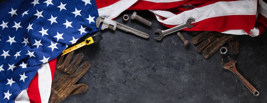 Construction and manufacturing tools with patriotic US, USA, American flag on dark black background
