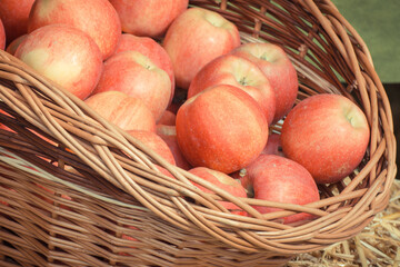 Fresh ripe apples in basket on stall at bazaar. Vintage photo