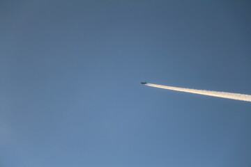 airplane in the sky contrails