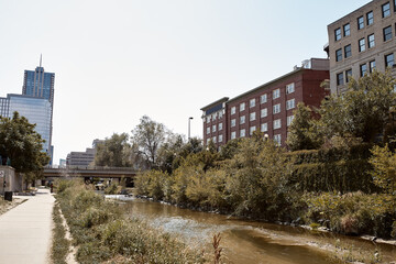 Apartments and condominiums overlooking Platte River on Cherry Creek Trail.  In the Riverfront Park neighborhood of Denver, Colorado.  USA