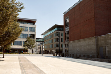 Courtyard surrounded by modern,  highrise office buildings near Union Station.  In Downtown Denver,...