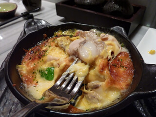 Close up shot of delicious grilled seafood with cheese