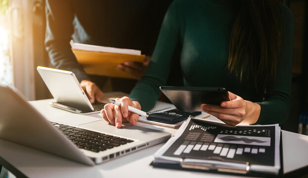  Business team meeting present.professional investor working with  Finance managers task. withlaptop smart phone and digital tablet