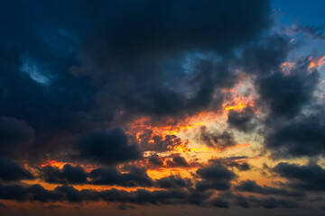 Naklejka na ściany i meble Colorful dramatic sunset cloudy sky