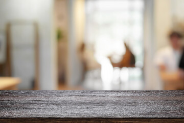 Cafe or Restaurant  blurred background with empty wood montage.