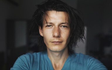 A close male dark portrait in the room