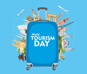World Tourism Day. Congratulatory poster. The inscription on the blue travel suitcase. Around the monuments of architecture. Vector graphics