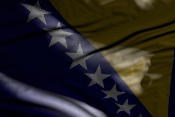 wonderful feast flag 3d illustration. - picture of dark Bosnia and Herzegovina flag with folds lying flat in shadows with light spots on it