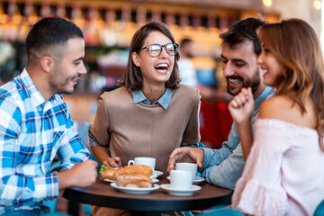 Young people enjoying breakfast.