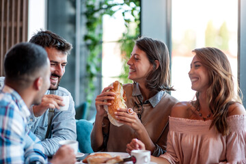 Young people enjoying breakfast.