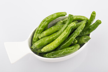 Green Organic Shishito Peppers in a bunch.