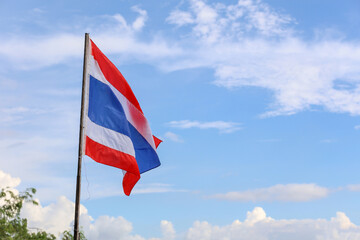 The thailand flag on wood pole have sky background