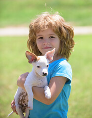 Close up portrait of cute child hugging dog. Little boy hugging a dog.