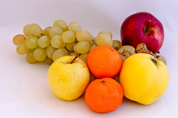 Group of different fresh ripe fruits - apple, quince, grapes and oranges, Sofia, Bulgaria  