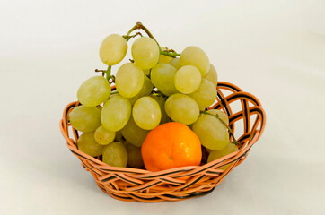 Fresh ripe orange and white grapes in basket, ready to eat, Sofia, Bulgaria  