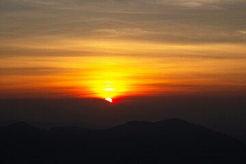 The peak of mountain with beautiful sunrise at point view. Good morning 