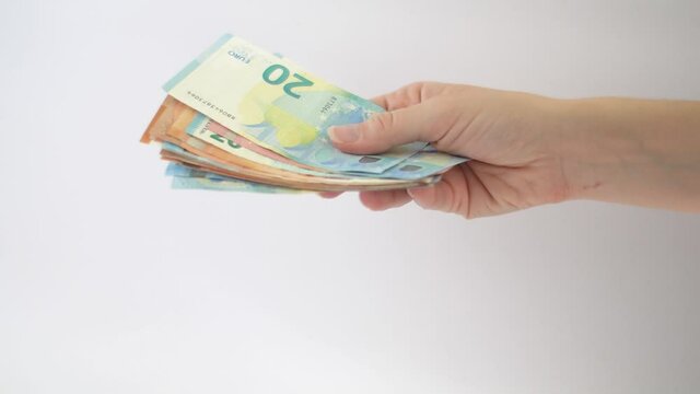 Caucasian woman giving euro money to man