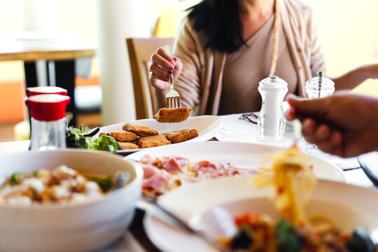Italian food meal at restaurant  with people eating background on day with natural light