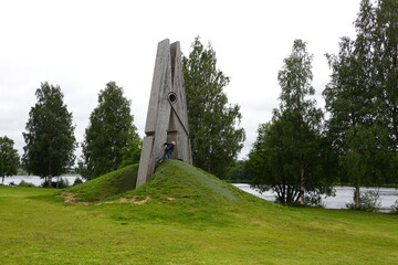 Big clothespin in a park with green grass