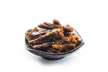 Beef jerky in a bowl on white background