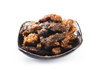 Beef jerky in a bowl on white background