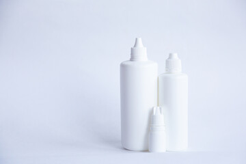 Contact lenses lens care products in white bottles on white background lens containers