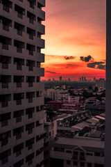 The high angle background of the city view with the secret light of the evening, blurring of night lights, showing the distribution of condominiums, dense homes in the capital community