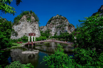 Fototapeta premium Khao Ngu Stone Park-Ratchaburi: July27 2020,atmosphere of natural tourist attractions,tourists and travelers come to see the beauty of mountains and various kinds of trees the urban area,Thailand.