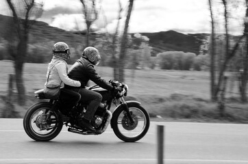 Obraz na płótnie Canvas girl and man on motorcycle