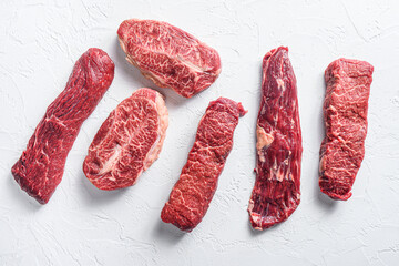Set of denver, top blade,  tri tip steak, machete, flank, bavette London broil  marble beef on white background top view