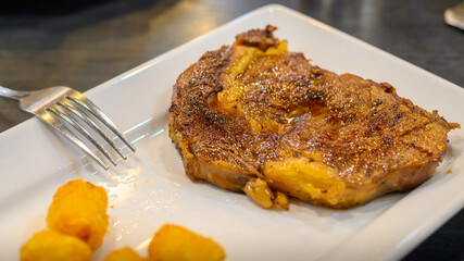 Steak on the plate with soft light.