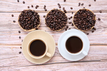 Top view coffee cup and coffee beans on old wood table background