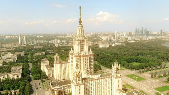 Aerial orbiting shot of the famous Moscow State University MSU building within cityscape of Moscow, Russia
