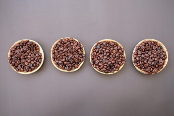 coffee cup and coffee beans on old wood table background