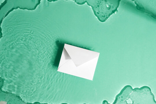 Paper Mockup Envelope On A Water Under Glass Texture.