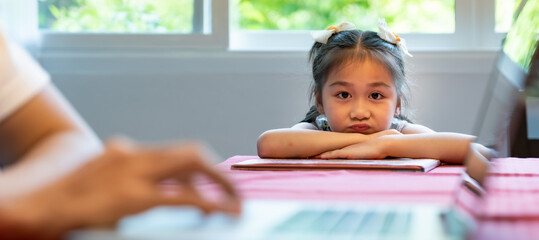 Daughter wait for her dad working.