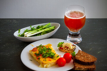 Healthy rustic breakfast. Fritata, fresh vegetables, bread and bread kvass.