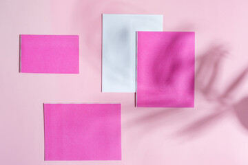 Mock-up papper envelope and cards with leaf shadows.