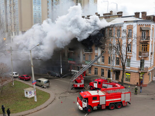 Odessa, Ukraine - December 29, 2016: A fire in apartment building. Strong bright light and clubs,...